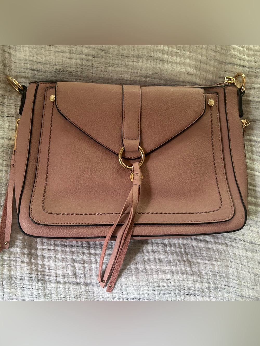 Women’s vegan Leather Crossbody Bag in Dusty Rose with Tassel Detail - Picture 1 of 3